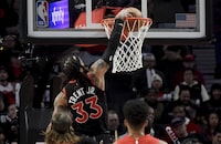 Toronto Raptors guard Gary Trent Jr. (33) dunks the ball during the first half of an NBA basketball game against the Portland Trail Blazers in Portland, Ore., Saturday, March 9, 2024. (AP Photo/Steve Dykes)