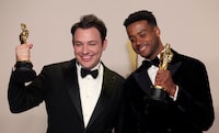 Ben Proudfoot and Kris Bowers pose with the Oscar for Best Documentary Short Film for "The Last Repair Shop" in the Oscars photo room at the 96th Academy Awards in Hollywood, Los Angeles, California, U.S., March 10, 2024. REUTERS/Carlos Barria