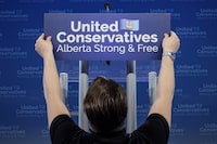 Technicians prepare the stage where United Conservative Party leader Jason Kenney with address supporters Calgary, Alta., Tuesday, April 16, 2019. One of the candidates in Alberta's 2017 United Conservative leadership race has been hit with $70,000 in fines for breaking fundraising rules. THE CANADIAN PRESS/Jeff McIntosh