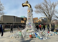 A prop depicting a water tap with cascading plastic bottles is displayed by activists near the Shaw Centre venue of penultimate negotiations for the first-ever global plastics treaty, in Ottawa, Ontario, Canada April 23, 2024.  REUTERS/Kyaw Soe Oo