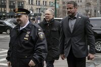 FILE - Wayne LaPierre, center, arrives at court in Lower Manhattan, Jan. 24, 2024, in New York. A lawsuit claiming Wayne LaPierre and other former National Rifle Association executives wildly misspent millions of dollars in donations on lavish perks for themselves is wrapping up in a Manhattan court after weeks of contentious testimony. Closing arguments are expected Thursday, Feb. 15, 2024. (AP Photo/Yuki Iwamura, File)