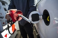 A man prepares to pump gas in Toronto, on April 1, 2019. 
Statistics Canada says retail sales in October posted their largest increase in five months, led higher by gains at gasoline stations and food and beverage stores.THE CANADIAN PRESS/Christopher Katsarov