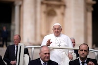 Pope Francis waves as he leaves after his weekly general audience in St. Peter's Square at The Vatican, Wednesday, April 10, 2024. (AP Photo/Andrew Medichini)