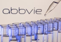 Test tubes are seen in front of a displayed Abbvie logo in this illustration taken, May 21, 2021. REUTERS/Dado Ruvic/Illustration