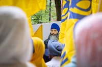 Homicide police in British Columbia say they will be providing a "significant update" on the killing of Sikh activist Hardeep Singh Nijjar, amid reports that arrests have been made in the case. A portrait of Nijjar is seen as protesters gather outside the Consulate of India in response to his shooting death, in Vancouver, B.C., Saturday, June 24, 2023. THE CANADIAN PRESS/Ethan Cairns