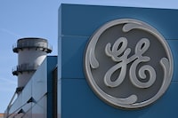 (FILES) The logo of US giant General Electric is pictured on the Belfort plant, eastern France, on March 29, 2021. American conglomerate General Electric, co-founded over 130 years ago by Thomas Edison, is opening a new chapter in its history on April 2, 2024: its spin-off into three independent entities, to enable them to focus on their very disparate core businesses. (Photo by SEBASTIEN BOZON / AFP) (Photo by SEBASTIEN BOZON/AFP via Getty Images)