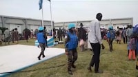 Locals gather at a UN peacekeeper camp following deadly attacks, in Dokura, Abyei region, Sudan-South Sudan border area, in this still image obtained from a social media video released January 28, 2024. Video obtained by Reuters THIS IMAGE HAS BEEN SUPPLIED BY A THIRD PARTY. NO RESALES. NO ARCHIVES