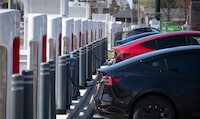 Tesla vehicles and Tesla charging stations at Applewood Village Plaza in Mississauga, Ont. are photographed on April 25, 2024. There are 32 charging stations at the plaza located just off the Queen Elizabeth Way.(Fred Lum/The Globe and Mail)