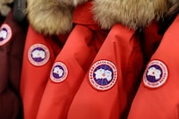 FILE PHOTO: Labels are seen on Canada Goose jackets in a store in Manhattan, New York City, U.S., February 7, 2022. REUTERS/Andrew Kelly/File Photo
