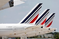FILE PHOTO: Air France Boeing 777 planes sit on the tarmac at Paris Charles de Gaulle airport in Roissy-en-France during the outbreak of the coronavirus disease (COVID-19) in France May 25, 2020. Picture taken May 25, 2020.   REUTERS/Charles Platiau/File Photo
