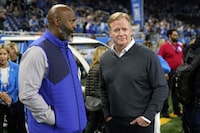 Detroit Lions general manager Brad Holmes, left, talks with NFL Commissioner Roger Goodell before the first half of an NFL football game, Sunday, Nov. 19, 2023, in Detroit. (AP Photo/Paul Sancya)