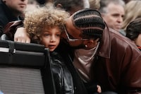 Drake's six-year-old son Adonis is getting into the rap game with his first track "My Man Freestyle." Drake sits with his son Adonis as they watch the Toronto Raptors take on the Los Angeles Lakers in NBA basketball action in Toronto on Wednesday, December 7, 2022. THE CANADIAN PRESS/Chris Young