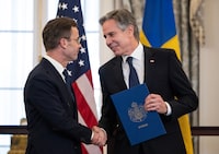 US Secretary of State Antony Blinken receives the NATO ratification documents from Swedish Prime Minister Ulf Kristersson during a ceremony at the US State Department, as Sweden formally joins the North Atlantic alliance, in Washington, DC, on March 7, 2024. Kristersson hailed his country's entry into NATO as a "victory for freedom," as it turned the page on two centuries of non-alignment following Russia's invasion of Ukraine. The accession "is a victory for freedom today. Sweden has made a free, democratic, sovereign and united choice to join NATO," he said at the ceremony. (Photo by ANDREW CABALLERO-REYNOLDS / AFP) (Photo by ANDREW CABALLERO-REYNOLDS/AFP via Getty Images)