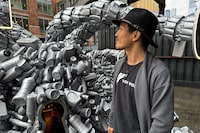 Artist and activist Benjamin Von Wong poses in front of his plastic waste installation on New York City’s High Line park, in New York, U.S., April 12, 2024. REUTERS/Andrew Hofstetter