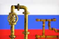 FILE PHOTO: Model of natural gas pipeline and Russian flag, July 18, 2022. REUTERS/Dado Ruvic/Illustration/File Photo