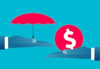 Finance and insurance concept, hand holding red umbrella with dollar gold coins