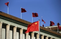 Chinese flag waves in front of the Great Hall of the People in Beijing, China, October 29, 2015. REUTERS/Jason Lee/File Photo