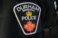 A 24-year-old nurse at a mental health facility in Whitby, Ont., is facing criminal charges after he allegedly sexually assaulted a patient in an adolescent program multiple times. Durham Regional Police say officers began an investigation after a person, who was an in-patient at Ontario Shores Centre for Mental Health Services, came forward with information in June. A Durham Regional Police officer's logo emblem is shown Tuesday Feb. 28, 2023. THE CANADIAN PRESS/Doug Ives