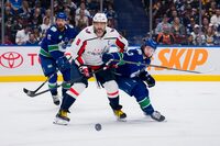 Mar 16, 2024; Vancouver, British Columbia, CAN; Washington Capitals forward Alex Ovechkin (8) battles with Vancouver Canucks defenseman Quinn Hughes (43) in the second period at Rogers Arena. Mandatory Credit: Bob Frid-USA TODAY Sports