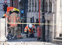 Firefighters continue the search for victims Monday, March 20, 2023 at the scene of last week’s fire that left one person dead and six people missing in Montreal. THE CANADIAN PRESS/Ryan Remiorz