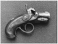 FILE--This is an undated file photo of a pistol touted as once belonging to John Wilkes Booth. The pistol was purchased for $70,000 at an auction in San Francisco, Tuesday, May 31, 1994. The gun, called the Philadelphia Deringer (cq.), was found on the stage of Ford's Theater in Washington D.C. on April 15, 1865, the day after President Lincoln was assassinated. This gun was not the one that killed Lincoln, but is believed that it fell to the stage when Booth leaped from the Presidential box. (AP Photo/HO)
