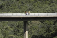 A view of a bridge a day after a bus plunged into a ravine on the Mmamatlakala mountain pass between Mokopane and Marken, around 300km (190 miles) north of Johannesburg, South Africa, Friday, March 29, 2024. A bus carrying worshippers on a long-distance trip from Botswana to an Easter weekend church gathering in South Africa plunged off a bridge on a mountain pass Thursday and burst into flames as it hit the rocky ground below, killing at least 45 people, authorities said. The only survivor was an 8-year-old child who was receiving medical attention for serious injuries. (AP Photo/Themba Hadebe)