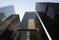 The Canadian flag flutters in the wind at the TD Centre in Toronto’s Financial District, on Mar 15, 2023.