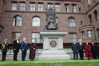 Elizabeth Dowdeswell, fourth from left, Lieutenant Governor of Ontario and Doug Ford, third from left, Ontario's Premier along with other guests unveil the newly placed statue honouring the late Queen Elizabeth II at Queen's Park in Toronto on Tuesday, November 7, 2023. THE CANADIAN PRESS/Nathan Denette