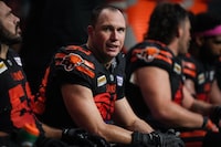 B.C. Lions defensive lineman Mathieu Betts sits on the bench during the second half of a CFL football game against the Calgary Stampeders, in Vancouver, B.C., Friday, Oct. 20, 2023. THE CANADIAN PRESS/Darryl Dyck