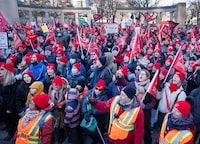 Striking teachers and their supporters hold a rally in front of Premier Francois Legault's office, Friday, Dec. 22, 2023 in Montreal. THE CANADIAN PRESS/Ryan Remiorz
