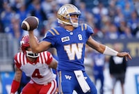 Winnipeg Blue Bombers quarterback Zach Collaros (8) throws against the Calgary Stampeders during first half CFL action in Winnipeg Friday, July 7, 2023.    THE CANADIAN PRESS/John Woods