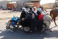 Palestinians fleeing north Gaza move southward as Israeli tanks roll deeper into the enclave, amid the ongoing conflict between Israel and Hamas, in the central Gaza Strip November 10, 2023.