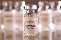 FILE PHOTO: A vial labelled "AstraZeneca COVID-19 Vaccine" is seen in this illustration taken January 16, 2022. REUTERS/Dado Ruvic/Illustration/File Photo