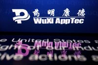 FILE PHOTO: The logo of Chinese drug research and development group WuXi AppTec is displayed alongside an open letter addressing a U.S. legislative initiative on its company website, in this illustration picture taken February 5, 2024. REUTERS/Florence Lo/Illustration/File Photo