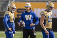 Injured Winnipeg Blue Bombers wide receiver Dalton Schoen plays with a football during practice in Hamilton, Ont., Thursday, Nov. 16, 2023. Winnipeg Blue Bombers will play the Montreal Alouettes in the 110th Grey Cup on Sunday. THE CANADIAN PRESS/Nick Iwanyshyn