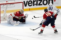 Toronto Maple Leafs center John Tavares (91) shoots to score against Florida Panthers goaltender Alex Lyon (34) during overtime of an NHL hockey game, Monday, April 10, 2023, in Sunrise, Fla. (AP Photo/Lynne Sladky)