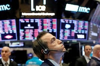 A trader works on the floor of the New York Stock Exchange shortly before the closing bell in February of 2020.