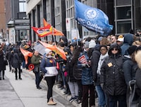 Canada Revenue Agency workers form a picket line as over 150,000 Public Service Alliance of Canada (PSAC) federal employees go on strike across the country, in Montreal, Wednesday, April 19, 2023. THE CANADIAN PRESS/Ryan Remiorz