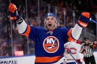 New York Islanders' Kyle Palmieri reacts after scoring the winning goal during the overtime period of an NHL hockey game against the Montreal Canadiens, Thursday, April 11, 2024, in Elmont, N.Y. (AP Photo/Seth Wenig)