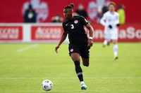 HAMILTON, ON - JANUARY 30:  Sam Adekugbe #3 of Canada dribbles the ball during a 2022 World Cup Qualifying match against the United States at Tim Hortons Field on January 30, 2022 in Hamilton, Ontario, Canada.  (Photo by Vaughn Ridley/Getty Images)