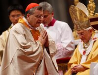 FILE PHOTO: New cardinal Raymond Leo Burke of the United States leaves after receiving his ring from Pope Benedict XVI during the Consistory ceremony in Saint Peter's Basilica at the Vatican November 21, 2010.  REUTERS/Tony Gentile/File Photo