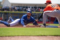 Toronto Blue Jays rightfielder George Springer is thrown out trying to steal third base during spring training action against the Baltimore Orioles Tuesday, March 19, 2024, in Dunedin, Florida. THE CANADIAN PRESS/Mark Taylor