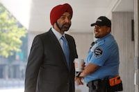 World Bank President Ajay Banga greets security guards as he arrives for his first day of work at World Bank headquarters in Washington, U.S. June 2, 2023.  REUTERS/Jonathan Ernst