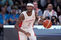 Canada's Shai Gilgeous-Alexander brings the ball down the court during the second half of a Basketball World Cup quarterfinal game against Slovenia in Manila, Philippines, Wednesday, Sept. 6, 2023. (AP Photo/Michael Conroy)