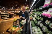 With a shopping list, Hugh Mountford shops for produce at the Sobeys grocery store in Leaside, on Mar 27 2019. 