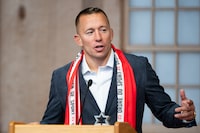 Mixed martial arts fighter Georges St-Pierre delivers remarks after receiving the Order of Sport during the Class of 2023 induction ceremony in Gatineau, Que., on Thursday, Oct. 19, 2023. THE CANADIAN PRESS/Spencer Colby
