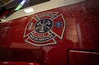 A Vancouver Fire and Rescue Services logo is seen on the first electric firetruck in Canada during an unveiling event in Vancouver, B.C, Monday, Dec. 4, 2023. THE CANADIAN PRESS/Ethan Cairns