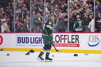 Oct 24, 2023; Saint Paul, Minnesota, USA; Minnesota Wild right wing Ryan Hartman (38) celebrates his hat trick against the Edmonton Oilers in the third period at Xcel Energy Center. Mandatory Credit: Brad Rempel-USA TODAY Sports