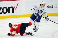 Florida Panthers' Brandon Montour (62) and Toronto Maple Leafs' Auston Matthews (34) get tangled up during second period NHL hockey action in Sunrise, Fla. on Tuesday, April 16, 2024. THE CANADIAN PRESS/Frank Gunn