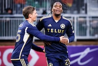 Vancouver Whitecaps FC forward Levonte Johnson (right) celebrates his goal with teammate midfielder Ryan Gauld during second half soccer action against the Cavalry FC in the Canadian Championship quarter-final, leg 1, in Calgary, Tuesday, May 7, 2024.THE CANADIAN PRESS/Jeff McIntosh